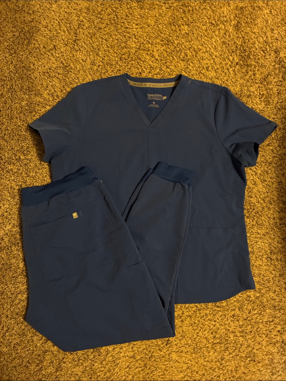 Fabletics scrub set with one pocket top and joggers in royal blue